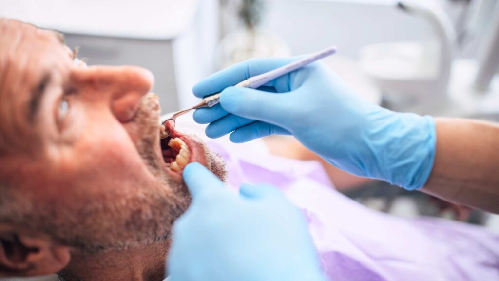 che cos'è la parodontite e come si cura | denti fissi | dentalian